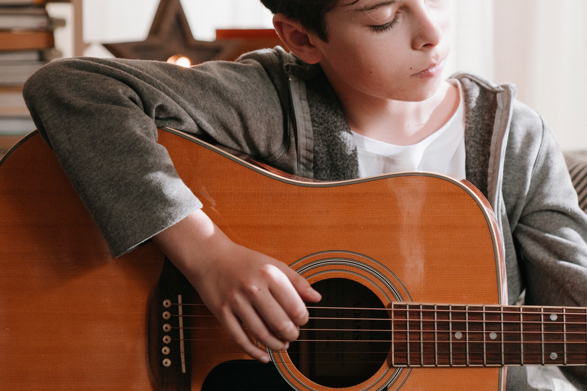 kid playing guitar