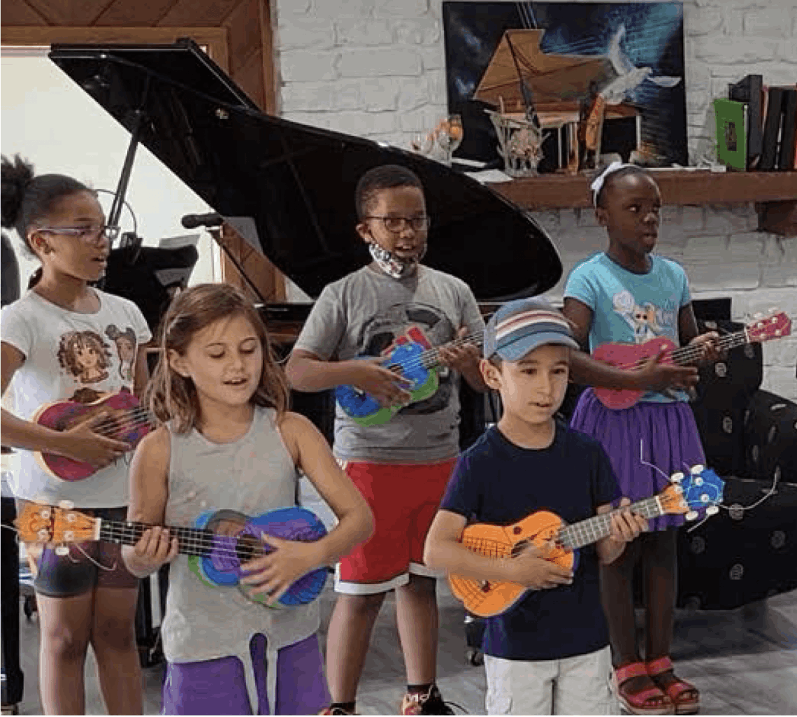 students learning to play ukulele